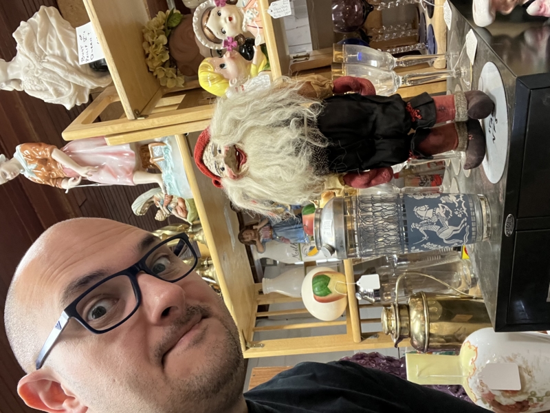 A selfie with an extremely odd-looking figure of a man.